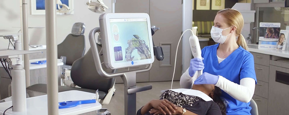 dentist using an iTero scanner machine