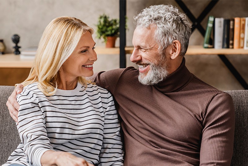 Happy couple sitting and smiling