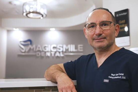 dr anatoly standing in a dental office